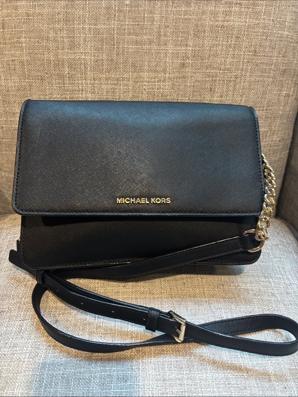 Micheal Kors black leather and chain strap crossbody bag.